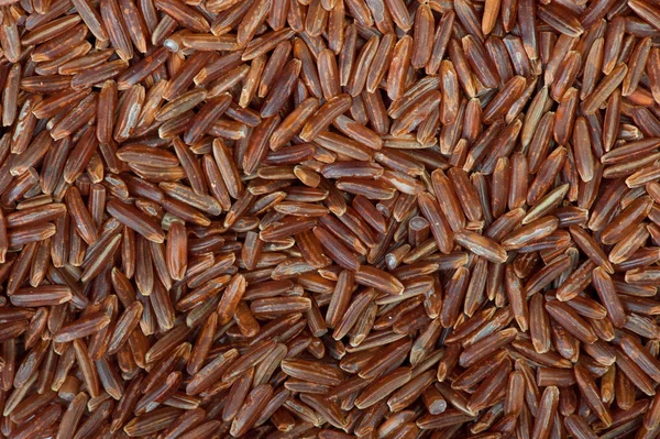 Surface covered with the red rice — Stock Photo, Image