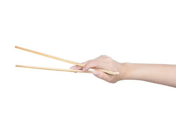 Female hand holding wooden chopsticks — Stock Photo, Image