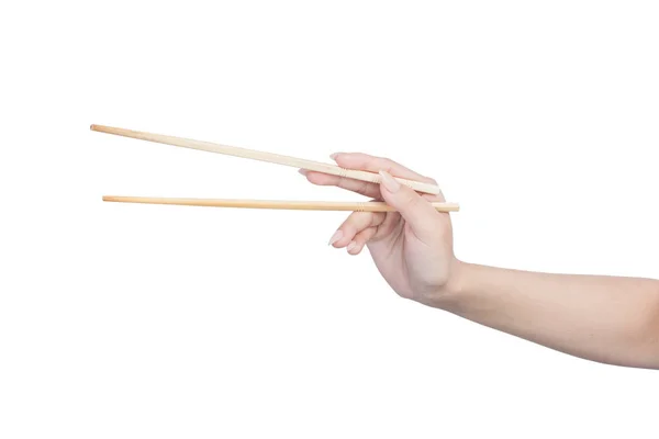 Ženská ruka hospodářství dřevěné hůlky — Stock fotografie
