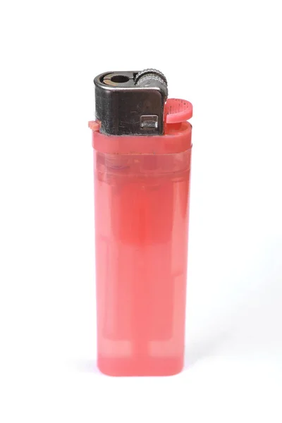 Cheap pink plastic gas disposable lighter Royalty Free Stock Photos