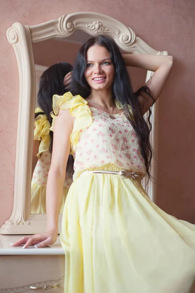Portrait of woman in yellow dress — Stock Photo, Image