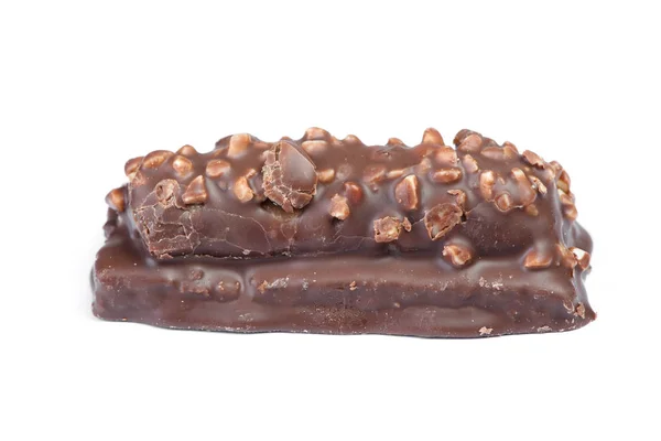 Small chocolate covered cake with crushed nuts — Stock Photo, Image