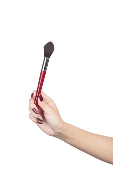 Kvinnlig hand med make-up artist Brush — Stockfoto