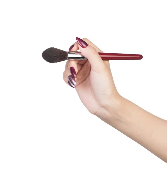 Main féminine avec pinceau maquilleur — Photo
