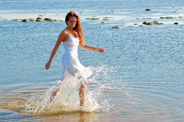 Young slim woman dressed in white sundress — Stock Photo, Image