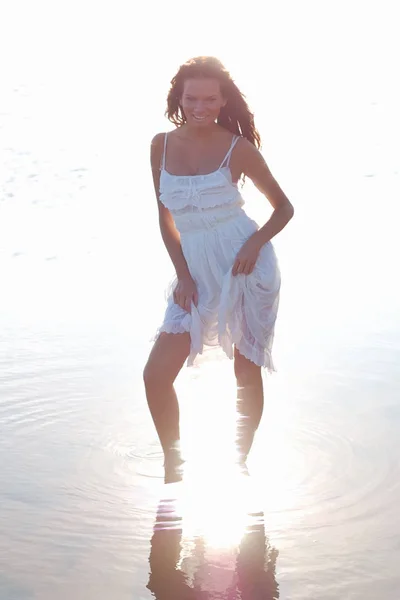 Young slim woman dressed in white sundress Stock Picture