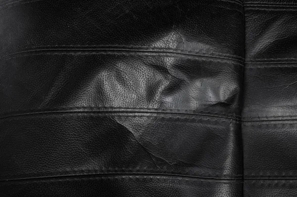 Black torn leather texture — Stock Photo, Image