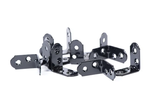 Group of  black metallic angle fixators — Stock Photo, Image