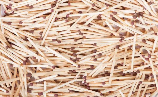 Heap of wooden matches with a sulfur head for texture — Stock Photo, Image