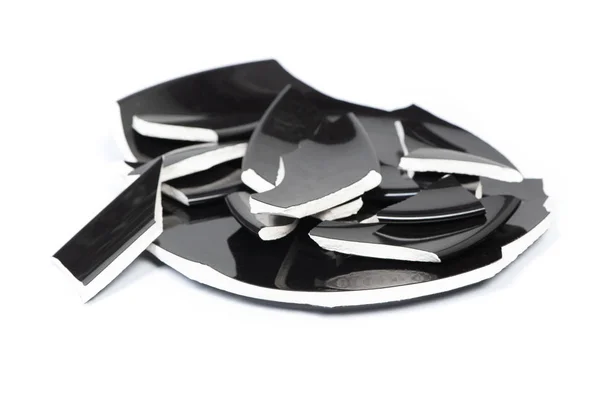 Broken black porcelain plate — Stock Photo, Image