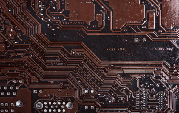 Modern printed brown circuit board, electronic circuit board, textolite. Background banner.