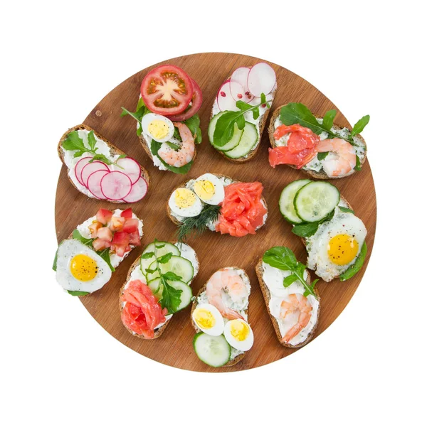 Set Van Verschillende Kleine Broodjes Ronde Snijplank Geïsoleerd Een Witte — Stockfoto