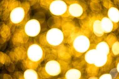 Bokeh yumuşak defokus ışık ile Noel altın soyut arka plan.