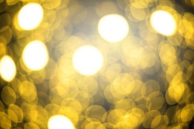 Bokeh yumuşak defokus ışık ile Noel altın soyut arka plan.