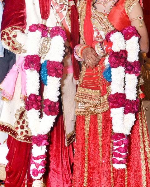 The bride and groom at the Indian wedding garlands or Jaimala ceremony