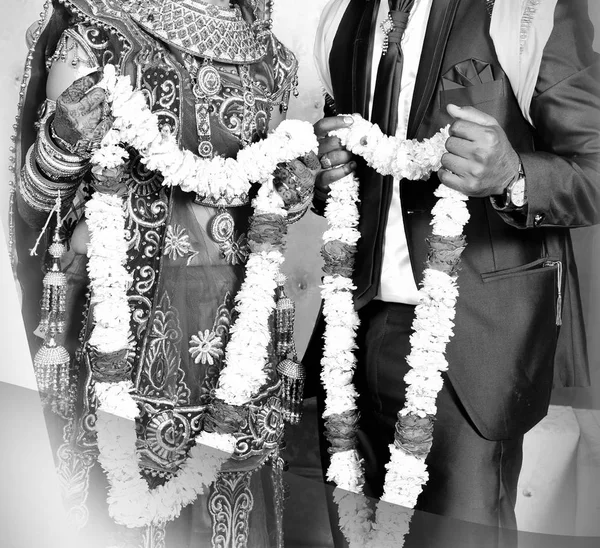 The bride and groom at the Indian wedding garlands or Jaimala ceremony