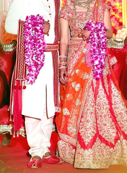 The bride and groom at the Indian wedding garlands or Jaimala ceremony