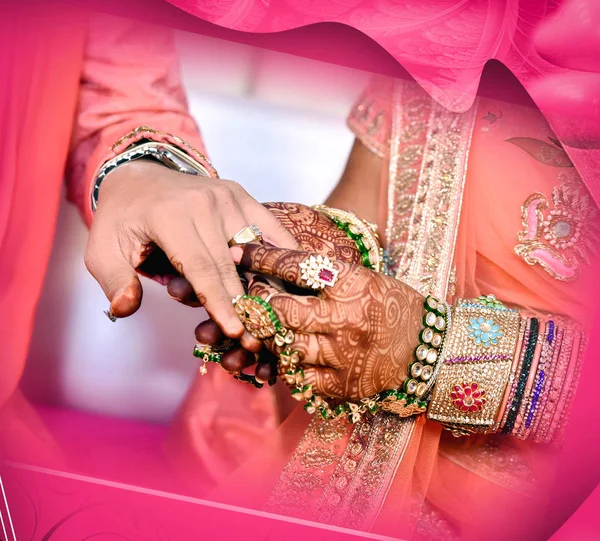 Indian Bride putting ring on indian Groom