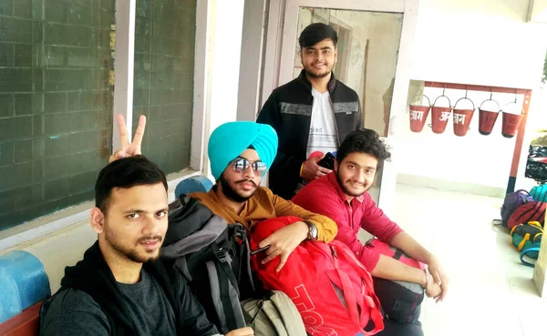 Rohtak, Haryana, India - 18 November, 2018: Close up of four cheerful friends in the spring, posing for a selfie shot, that handsome brunet is taking
