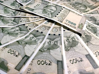 Group of Five Hundred Rupees Note isolated in a White Background