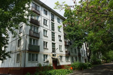 Moscow - September 2016: Old five story residential buildings, the program of housing renovation. clipart