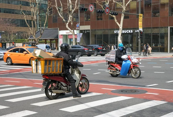 Seul, Kore Cumhuriyeti Ticari scooter sürücüleri. Stok Resim