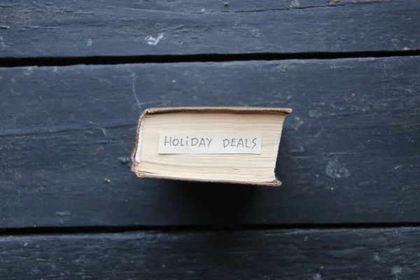 Holiday Deals. The inscription on the tag and the book. Vintage style.