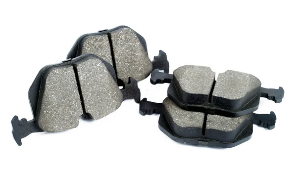 beyaz arkaplanda araba diski fren pedleri, izole, seçici odak