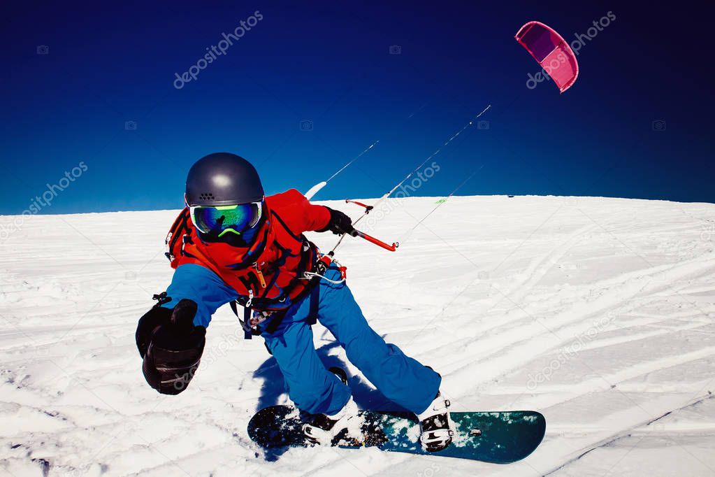 Snowboarder with kite