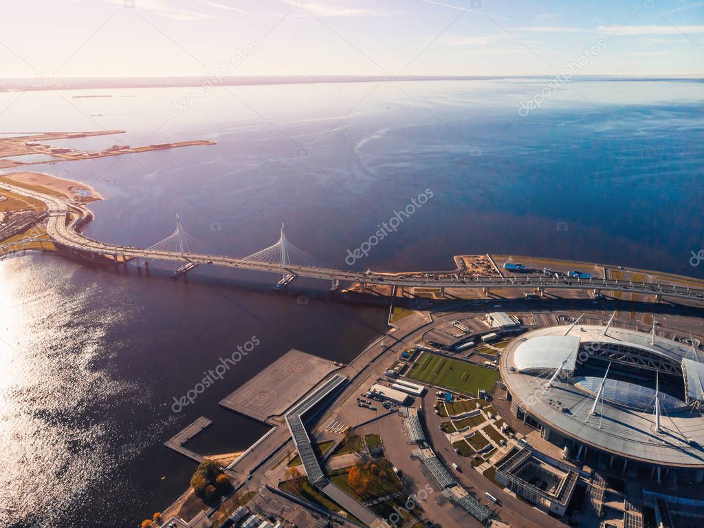Stadium St. Petersburg. Zenit Arena. Gulf of Finland. Clear autumn day. Blue sky. Helipad. Sun glare