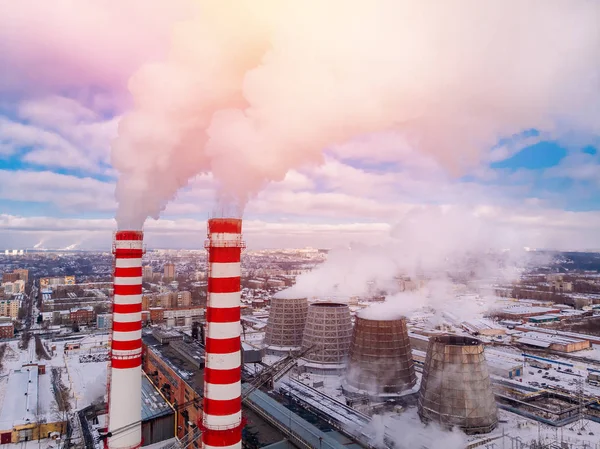 Aerial top view clouds of smoke and steam cooling tower industrial heat electro central coal. Environmental pollution concept