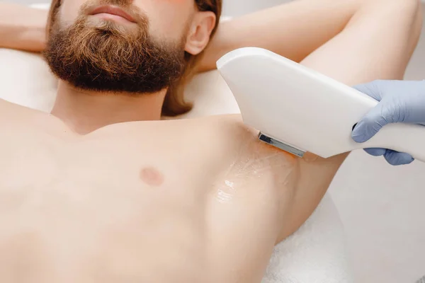 Smooth skin man under arms. Laser hair removal.