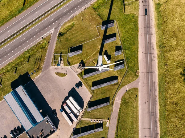 Top VIEW of three roads leading to station which generates electricity using solar panels and wind