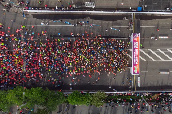 Tomsk, Russia - June 9, 2019: International Marathon Jarche athletes runners crowd are at start. Aerial top view — Stock Photo, Image