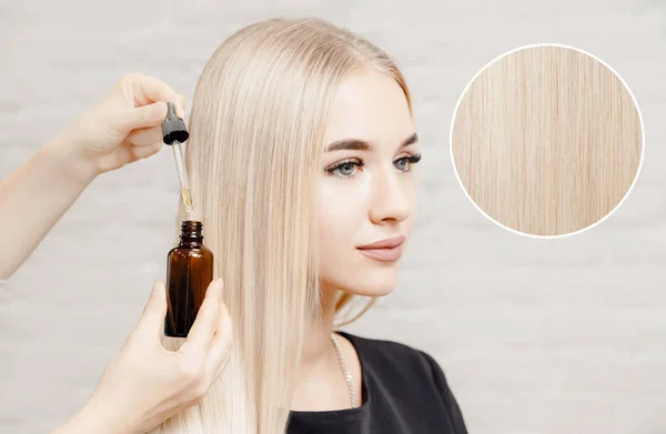 Master hairdresser procedure oil hair treatment for woman. Concept spa salon.