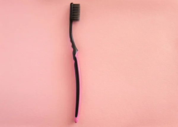 Toothbrush for brushing teeth on pink background, pastel colors — Stock Photo, Image