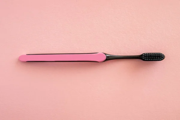 Toothbrush for brushing teeth on pink background, pastel colors — Stock Photo, Image