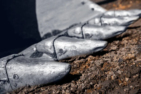 Close up of iron teeth loader excavator bucket with parts of soil — Stockfoto