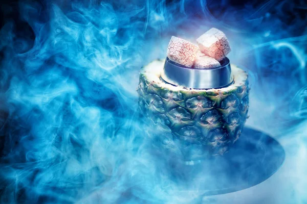 Hot coals hookah in pineapple bowl for smoking shisha traditional Turkish holiday