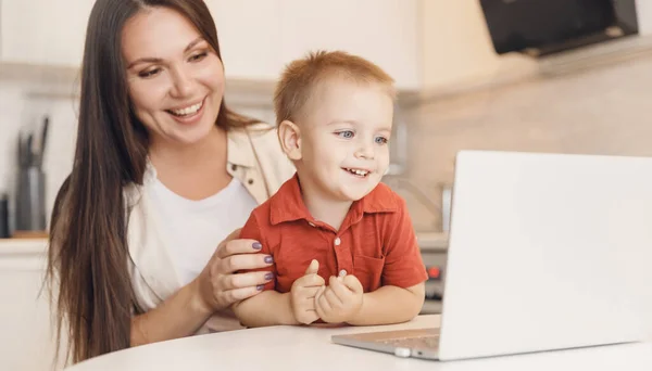 Mom and son taking selfie or video call to father or family. Communication quarantine people concept