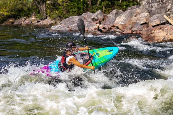 Extreme sport rafting whitewater kayaking. Guy in kayak sails mountain river — Stock Photo, Image