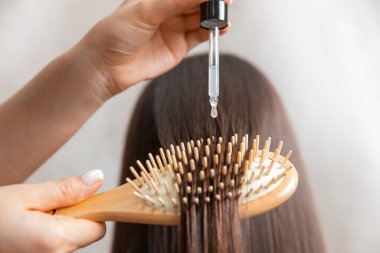 Oil hair treatment for woman. Concept hairdresser spa salon clipart