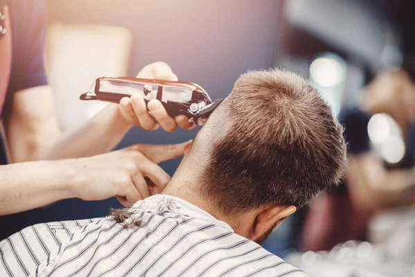 Hairdresser cuts hair men in barbershop. Barber doing correct trim electric shaver — Stock Photo, Image