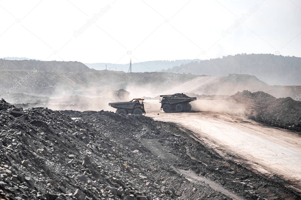 Big yellow mining truck coal transportation. Open pit mine industry
