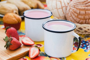 Atole de fresa, mexican traditional beverage and bread, Made with cinnamon and strawberries in Mexico clipart