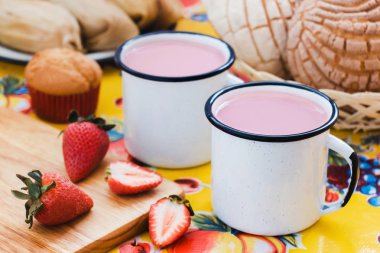 Atole de fresa, mexican traditional beverage and bread, Made with cinnamon and strawberries in Mexico clipart