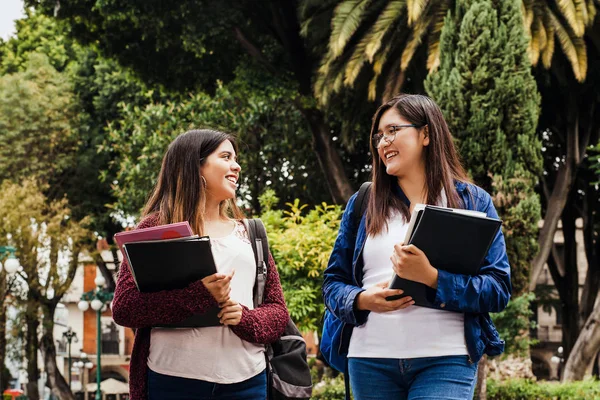 Couple of female students, hispanic women and latin friends in Mexico, mexican young people