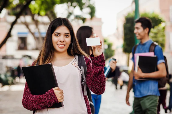 Latin female student, Hispanic girl in Mexico and group of mexican students at Background in Mexico