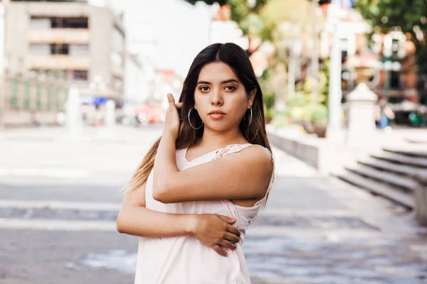 Mexican latin woman, portrait of pretty young teenager student girl in Mexico city
