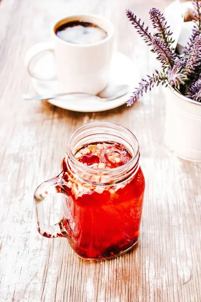 Tisane Red Herbal Tea Transparent Glass Jar Table Outdoors Tea — Stock Photo, Image